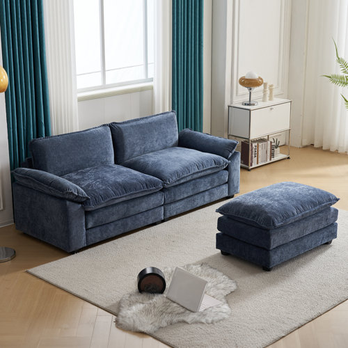 Close-up of double cushions on chenille sofa